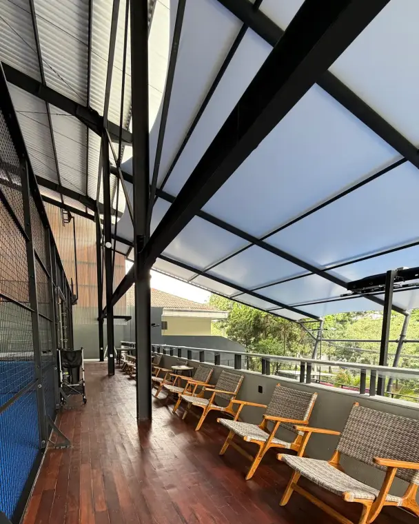 Teak deck beside the court