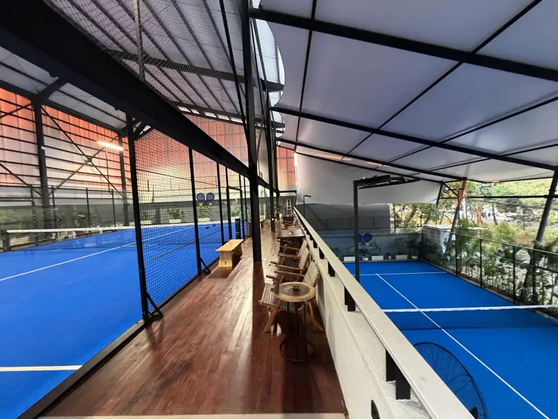 Teak deck overlooking both courts