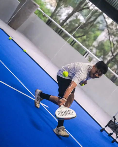 A player hitting a low forehand